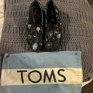 TOMS Black Space-Themed Slip-Ons